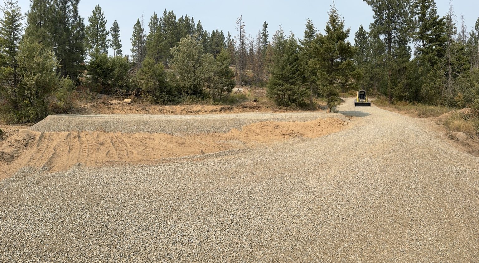 Finished gravel driveway intersection and turnaround